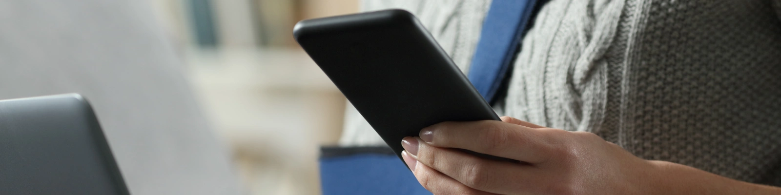 holding a mobile phone